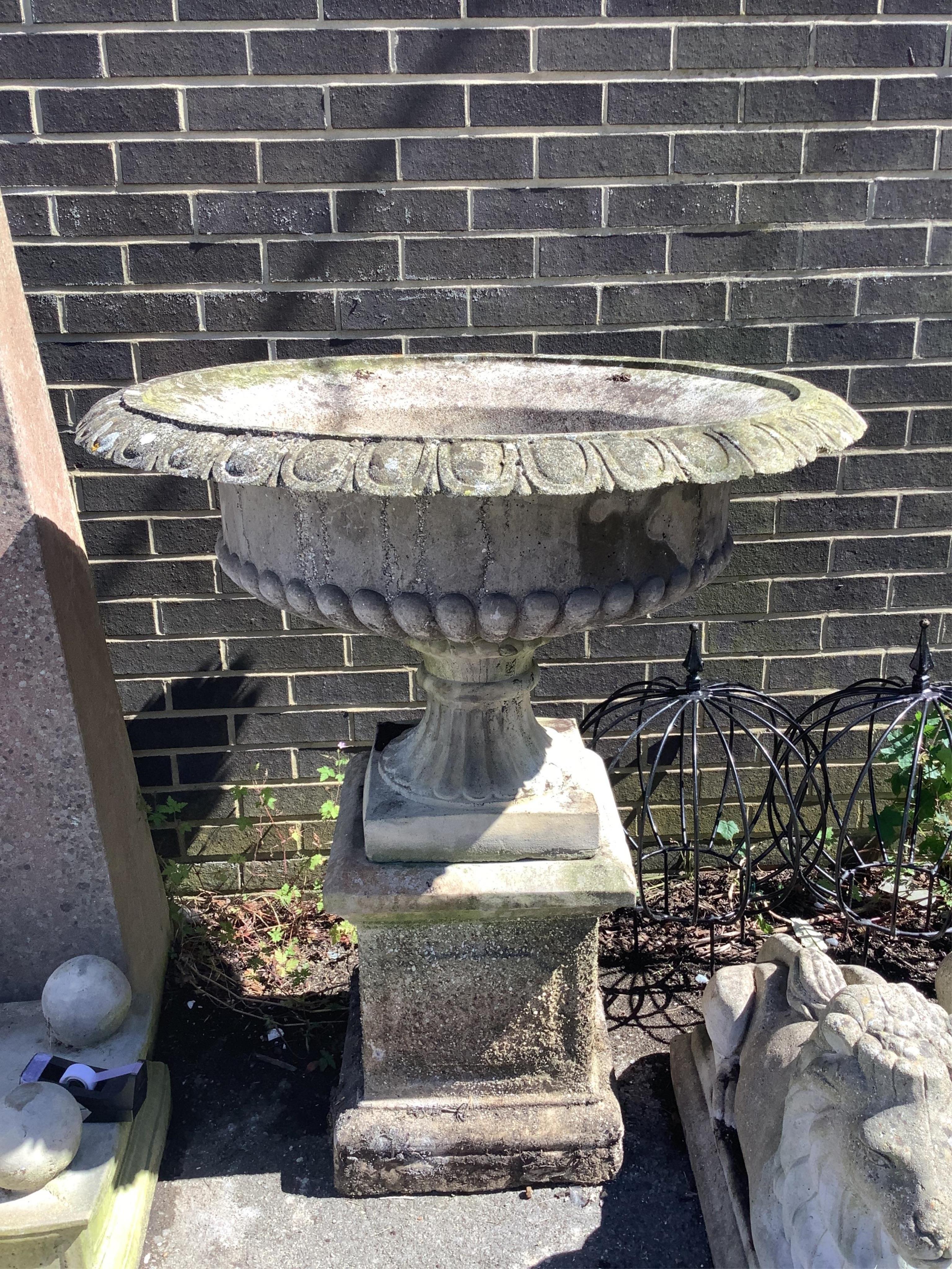 A large reconstituted stone campana garden urn, diameter 95cm, height 110cm. Condition - fair